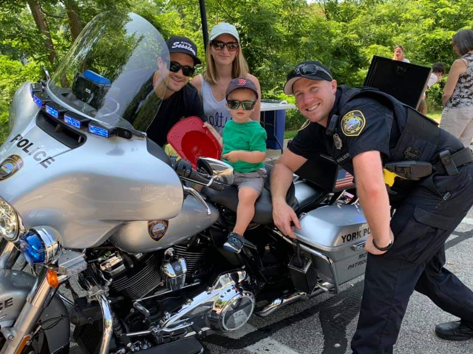 Officer McKinnon with children on morotcycle